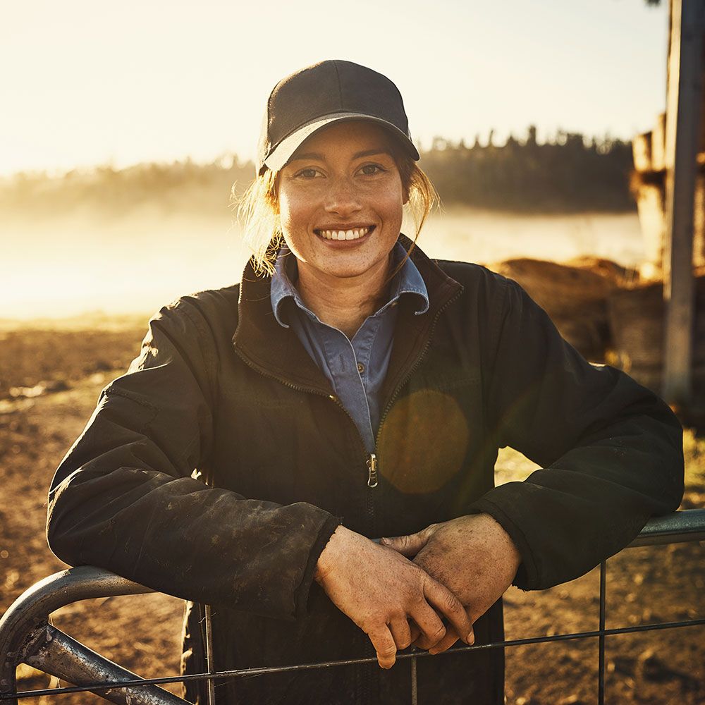 Woman standing in farm field