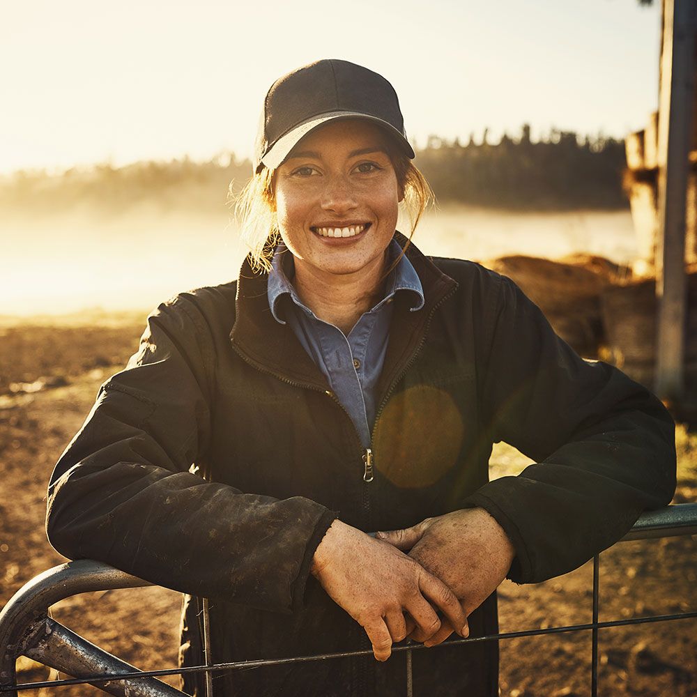 employer-1-compressor Woman standing in farm field